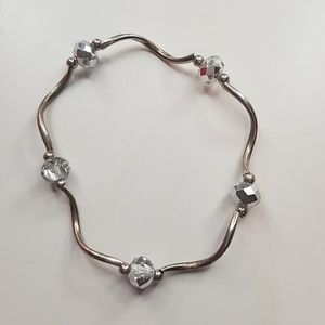 Silver colored and white beaded bracelet